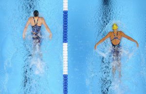 Kelsi Worrell, left, and Katie McLaughlin swim in the women's 200-meter butterfly preliminaries at the U.S. Olympic swimming trials, Wednesday, June 29, 2016, in Omaha, Neb. Worrell won the heat and McLaughlin took fourth. (AP Photo/Mark J. Terrill)
