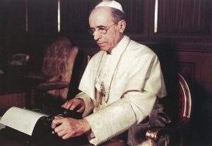 Pope Pius XII writes one of his wartime Christmas radio messages using a typewriter at the Vatican in this undated photo. On Nov. 4 the Vatican opened a major exhibit on the life and pontificate of Pope Pius XII, highlighting the late pope's actions on behalf of Jews and others who suffered during World War II. (CNS photo/courtesy of Libreria Editrice Vaticana) (Nov. 7, 2008) See PIUS-EXHIBIT Nov. 4, 2008.